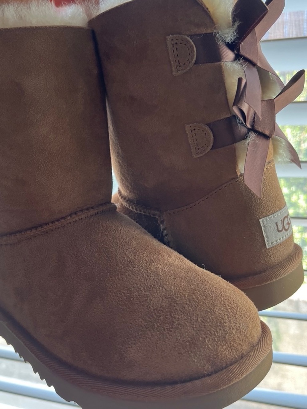 UGG Kids Brown Suede Bow Back Boots
Like new .